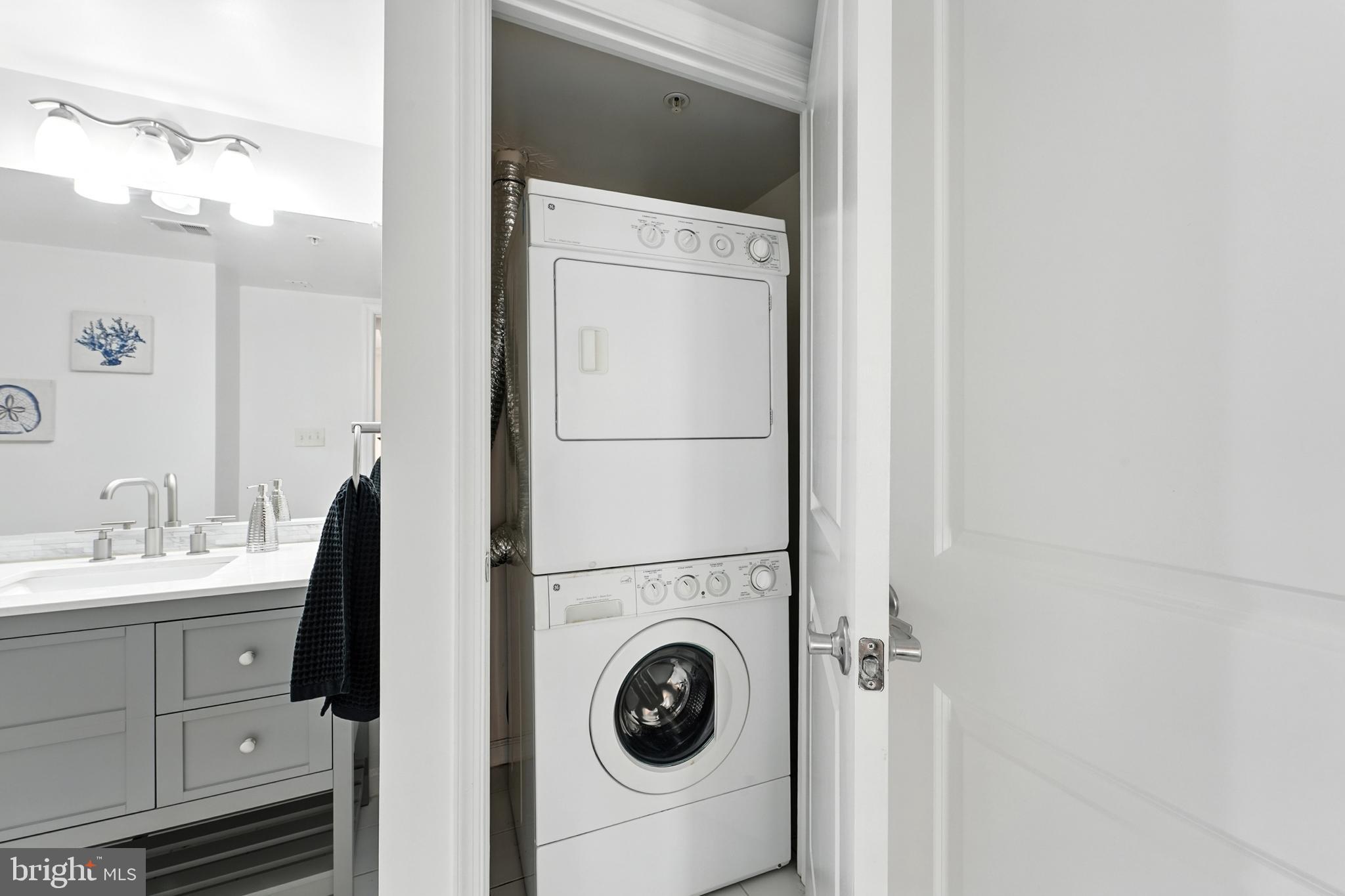 7923 Eastern Avenue Northwest, Unit 303 Silver Spring, MD 20910 - Photo 25 of 38 a utility room with dryer and washer