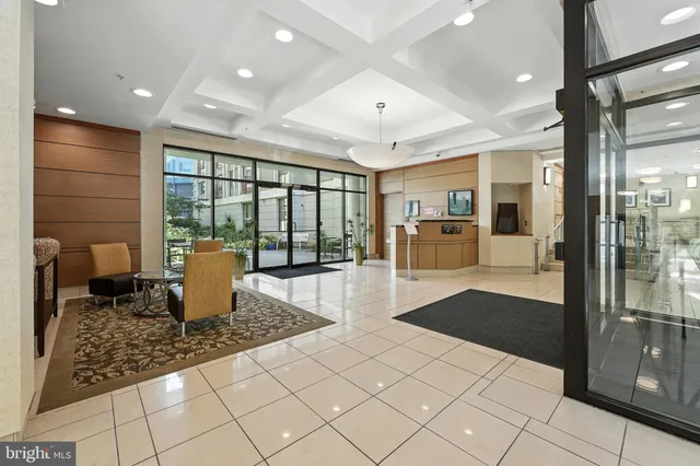 a open kitchen with stainless steel appliances granite countertop a refrigerator and stove