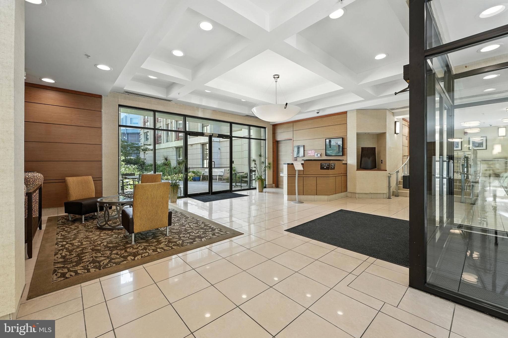 7923 Eastern Avenue Northwest, Unit 303 Silver Spring, MD 20910 - Photo 3 of 38 a open kitchen with stainless steel appliances granite countertop a refrigerator and stove