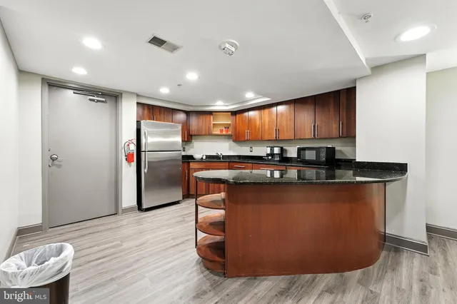 a view of a building with potted plants