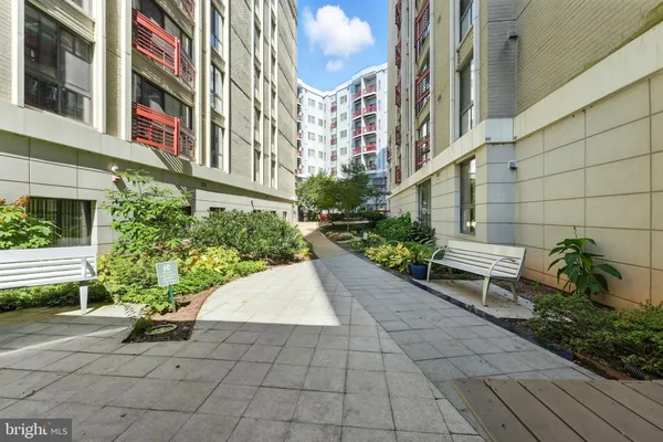 a view of a pathway with house on both side