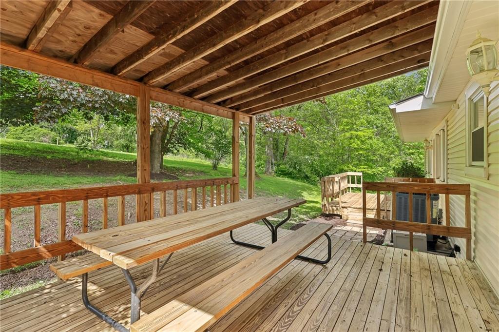 1317 Willowbrook Road New Castle, PA 16101 - Photo 33 of 40 Covered Deck with Picnic Table