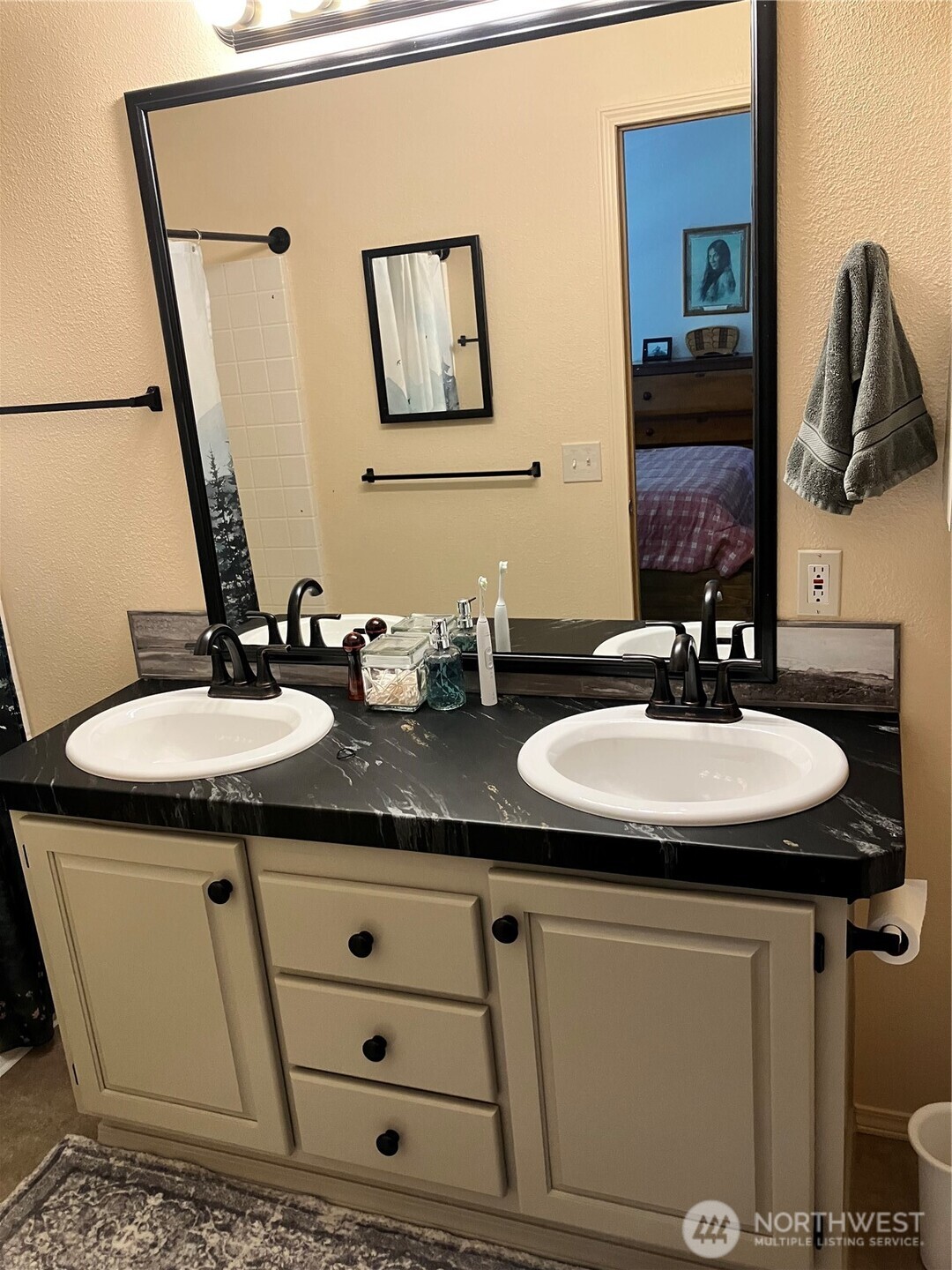1171 Ray Hicks Street Raymond, WA 98577 - Photo 20 of 33 a bathroom with a sink and a mirror