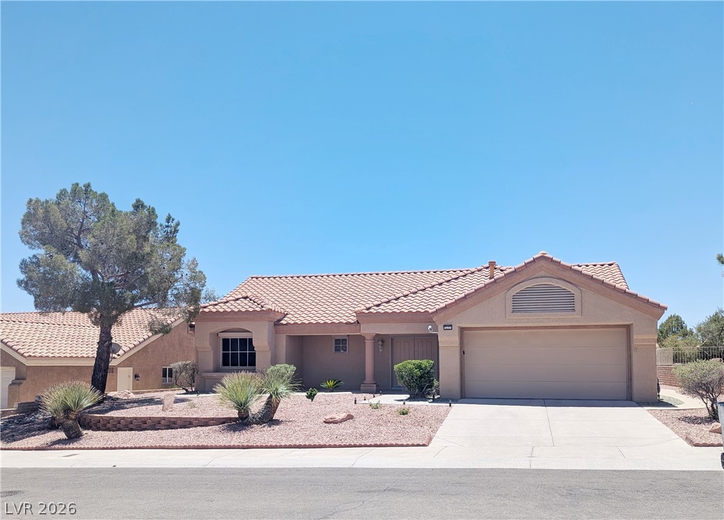 9433 Quail Ridge Drive Las Vegas, NV 89134 - Photo 1 of 23 A well-maintained desert landscape frames this welcoming single-story residence with an attached garage.