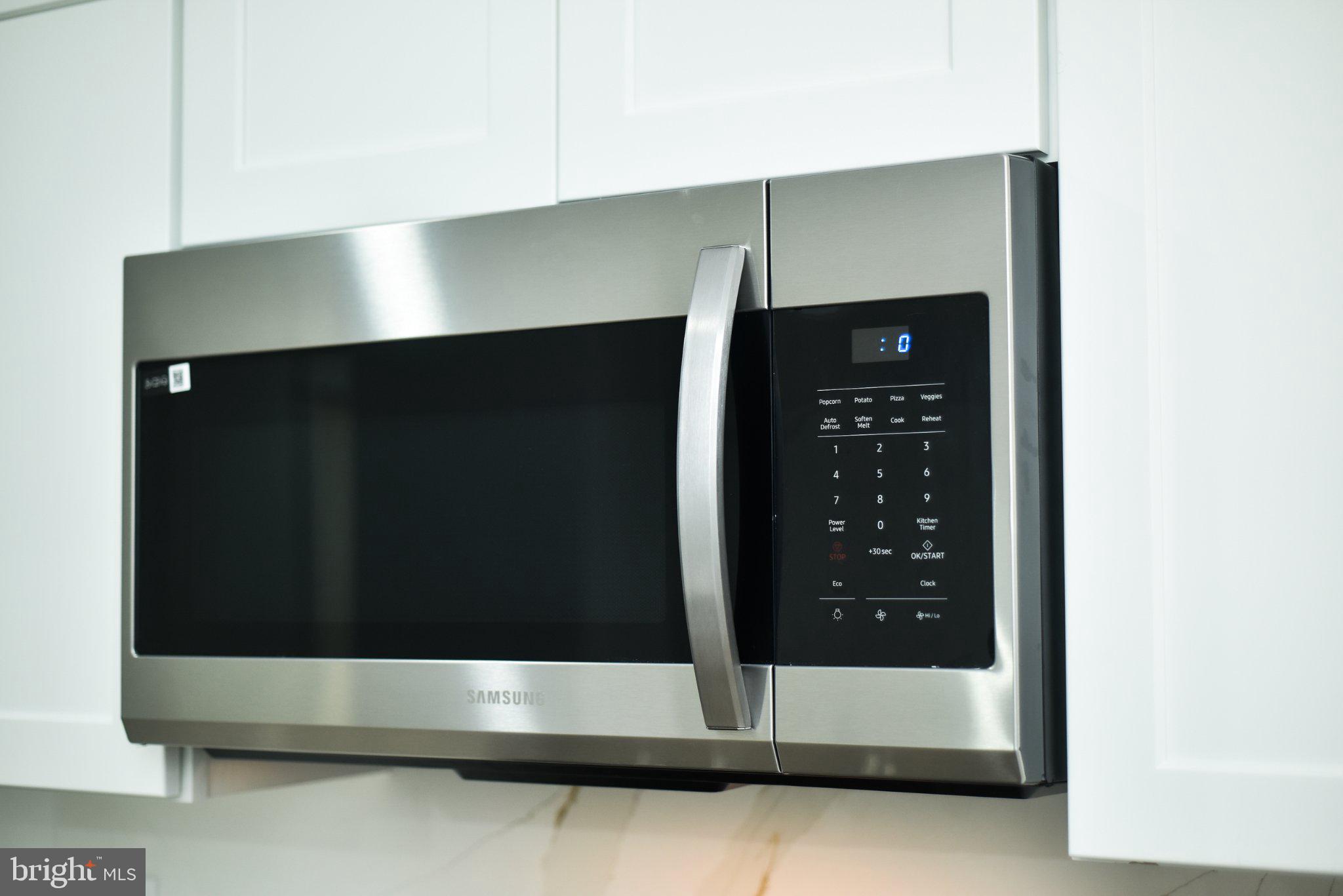 3704 Suitland Road Southeast Washington, DC 20020 - Photo 15 of 70 Sleek stainless steel microwave design.