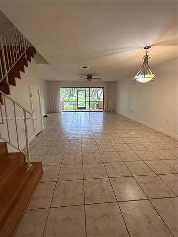 a view of outdoor space with sliding window