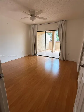 a bathroom with a double vanity sink a toilet and a mirror