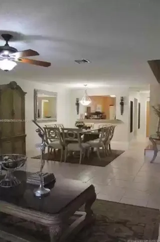 a room with lots of chairs and mirrors