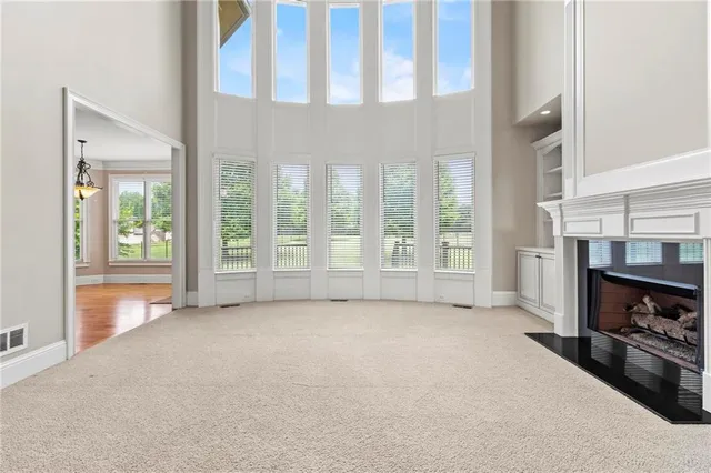 a kitchen with stainless steel appliances granite countertop a refrigerator a stove a sink and a oven