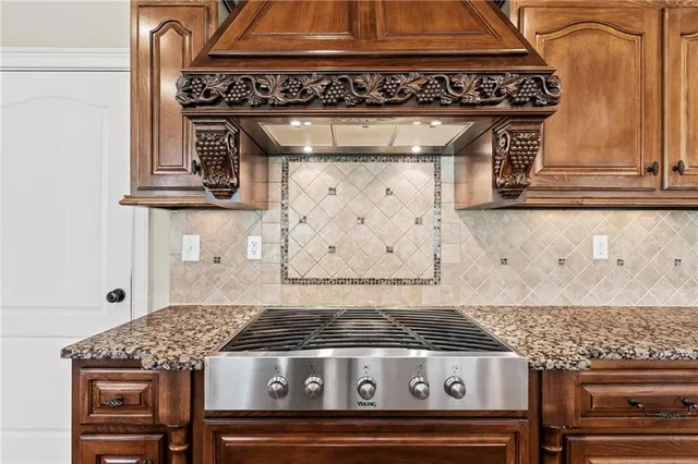 a view of a living room and kitchen with furniture wooden floor and windows