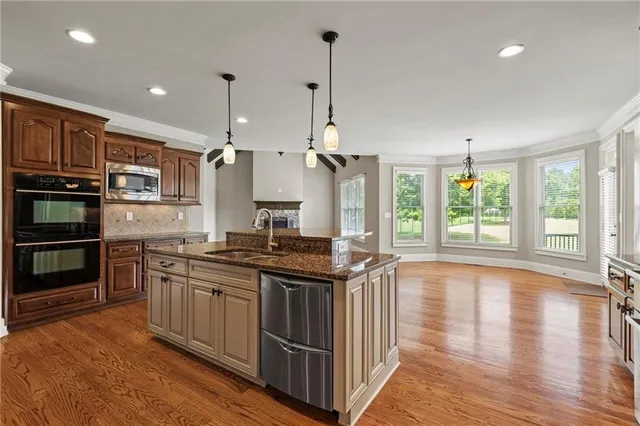 a view of livingroom with furniture wooden floor and chandelier