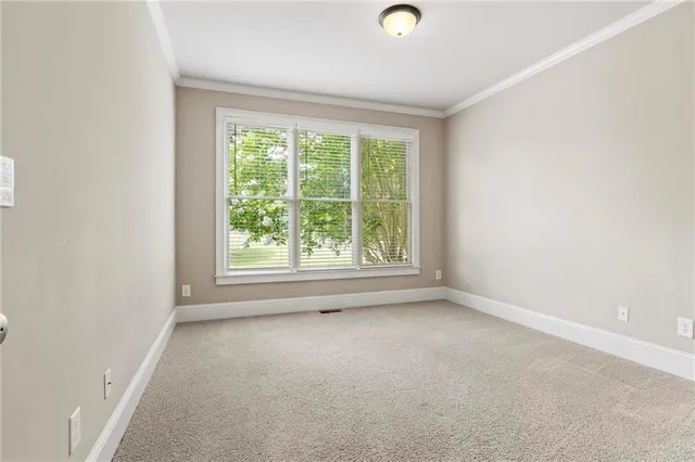 a view of empty room with a fireplace