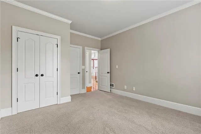 a view of a livingroom with a ceiling fan and a chandelier
