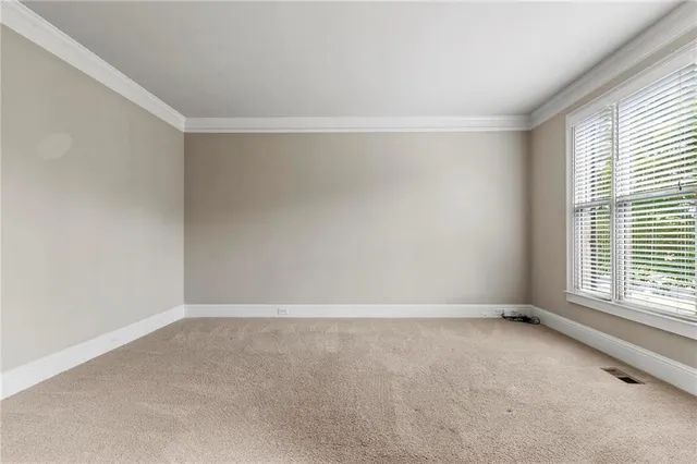 a bathroom with a tub shower and toilet