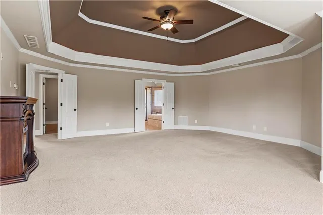 a white toilet sitting next to a bath tub