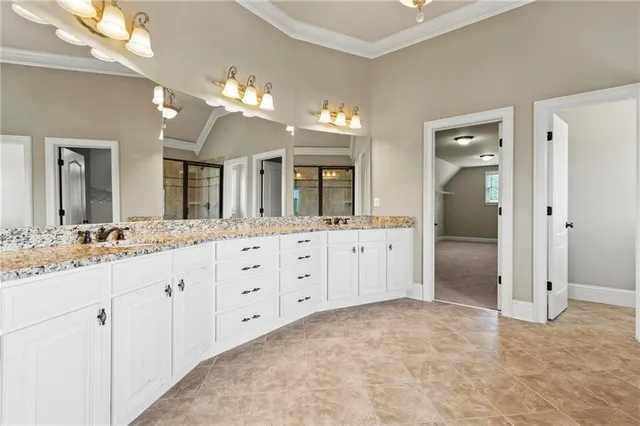 a view of a hallway with walk in closet