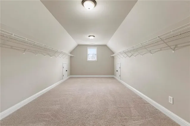 a view of an empty room and a ceiling fan