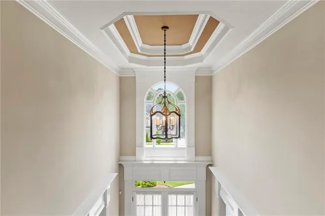 a view of a livingroom with a ceiling fan and window