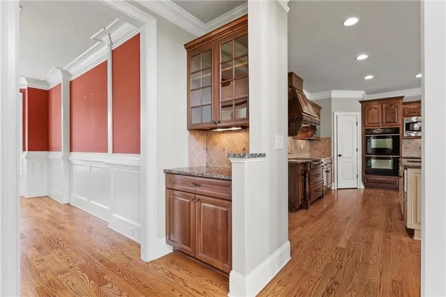 a view of an empty room with a fireplace and a window