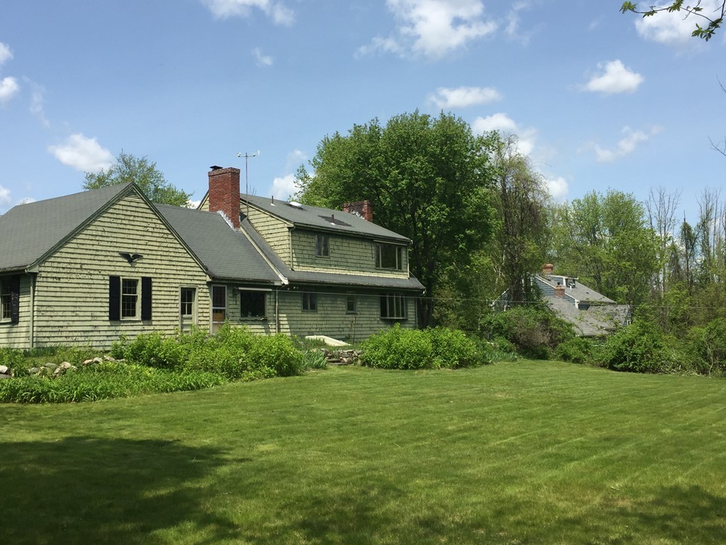 134 Pelham Island Road Wayland, MA 01778 - Photo 2 of 4 a front view of house with yard and green space