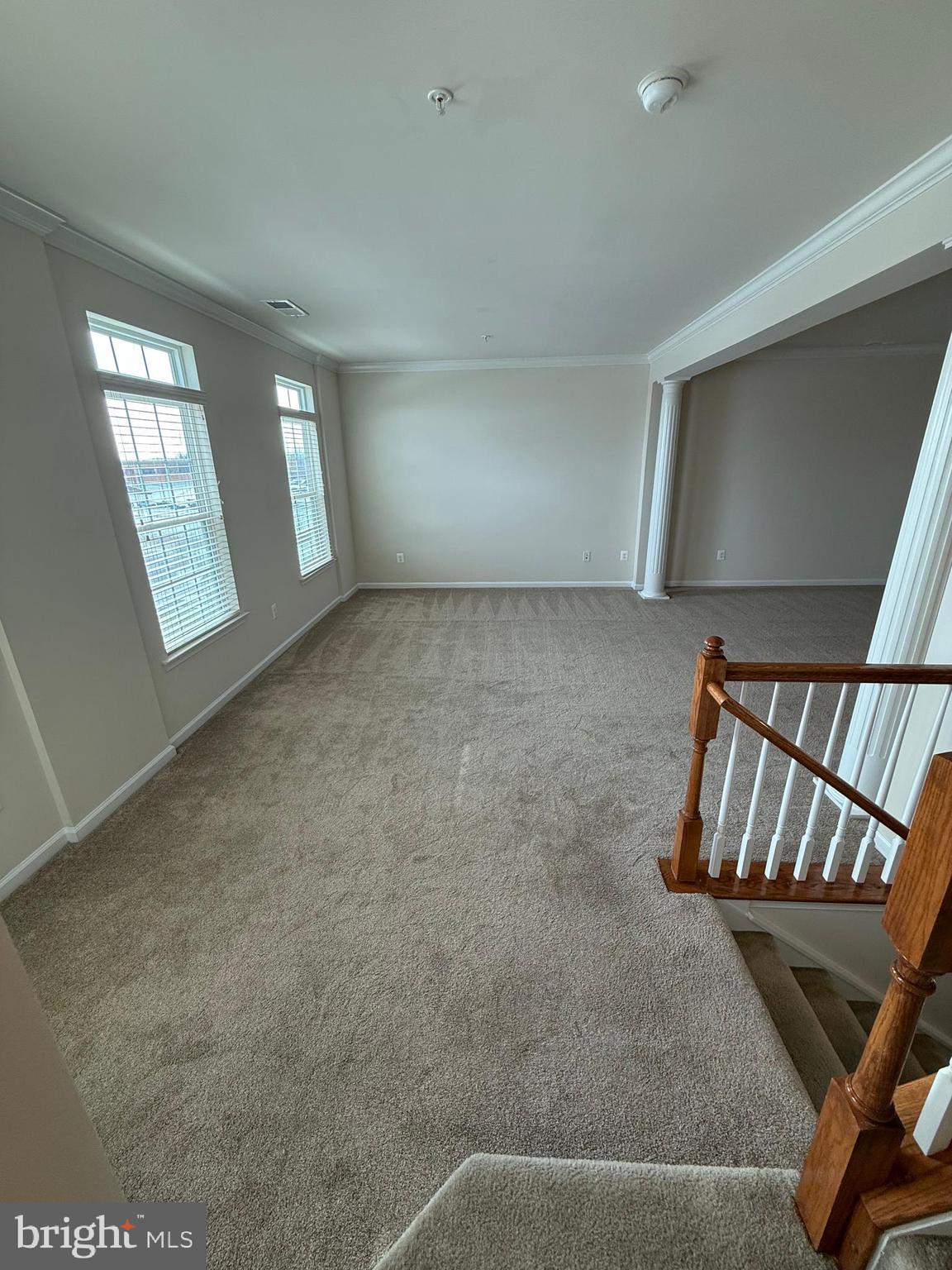 202 B Mill Pond Road Frederick, MD 21701 - Photo 5 of 44 a view of an empty room with windows & cabinet