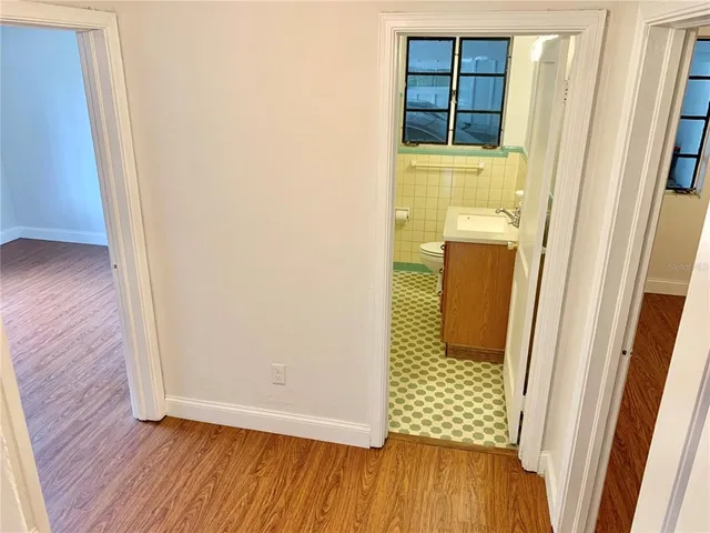 a view of front door with wooden floor