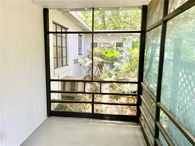 a view of a glass door with a outdoor space
