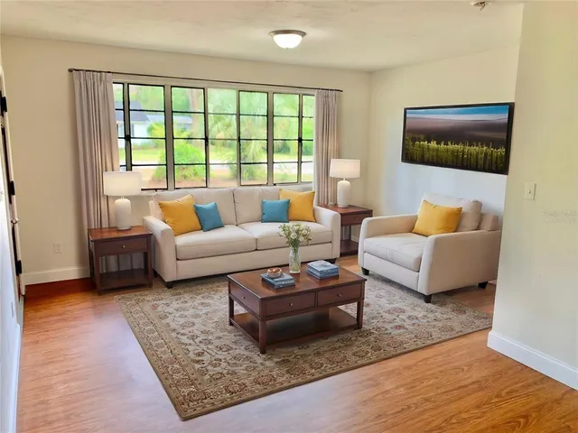 a living room with furniture and a rug