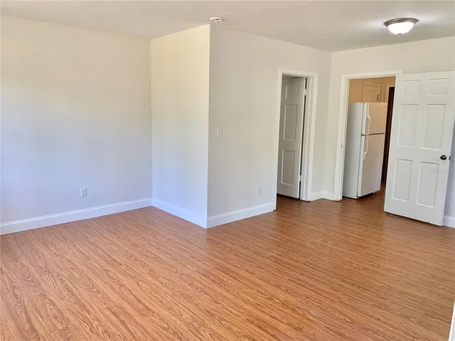 a view of a livingroom with wooden floor