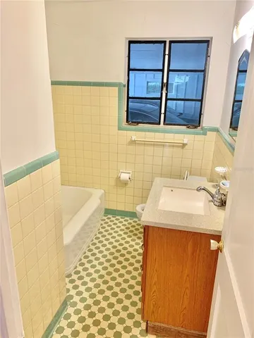 a bathroom with a sink and a shower