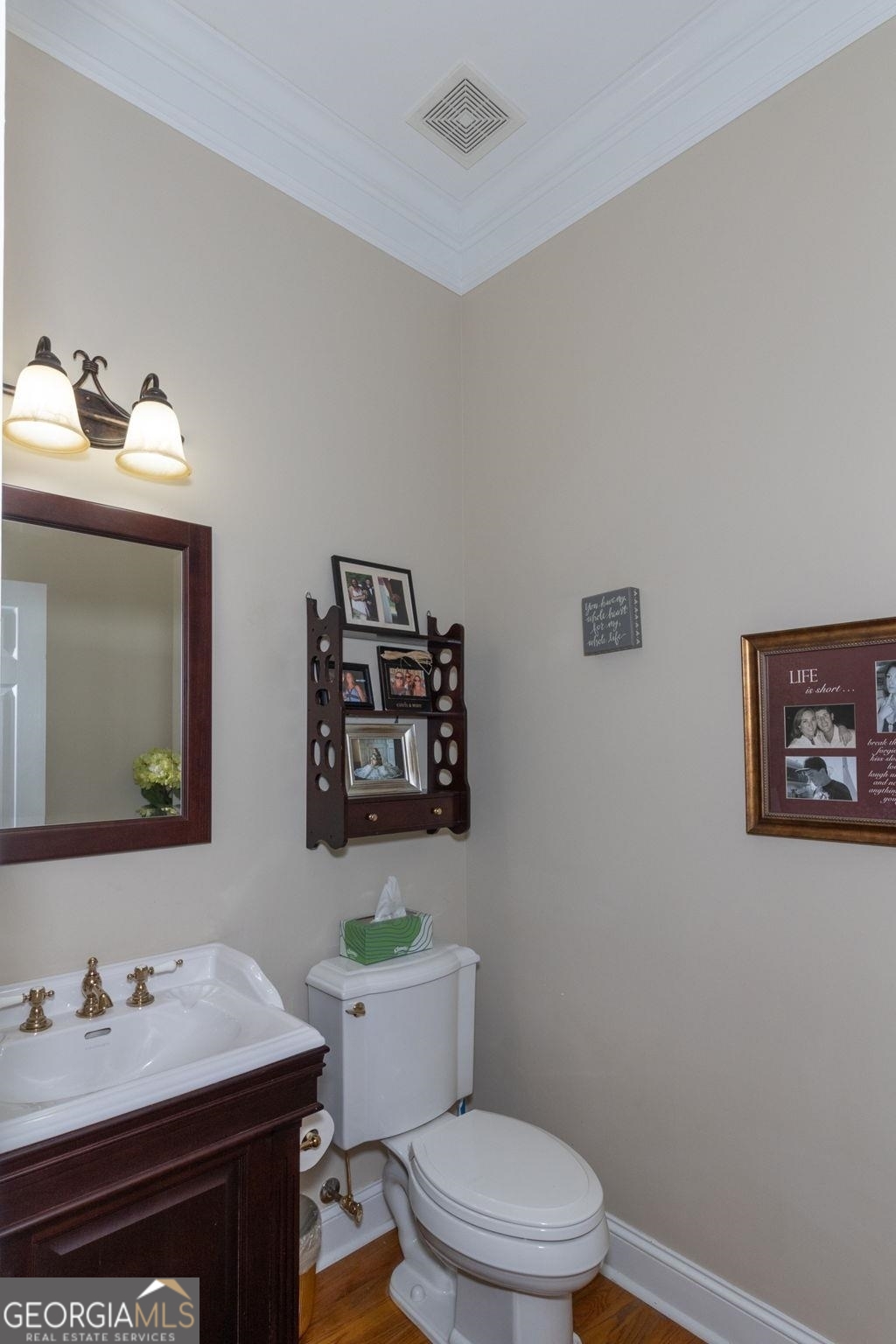 551 Mountain Ridge Drive Manchester, GA 31816 - Photo 21 of 72 The powder room is located on the main floor. It is convenient for guests.