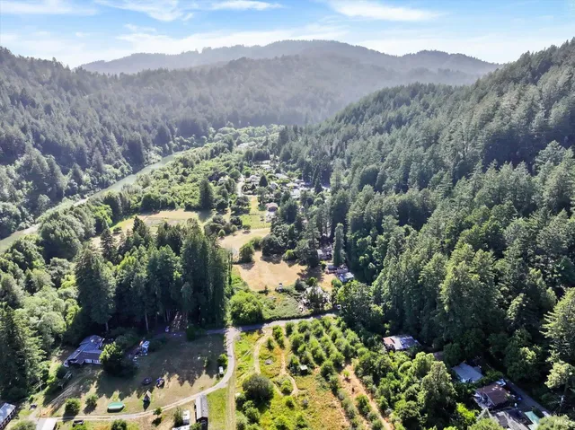 a view of two chairs in patio with wooden fence