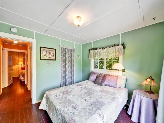 a bed room with a bed and a window