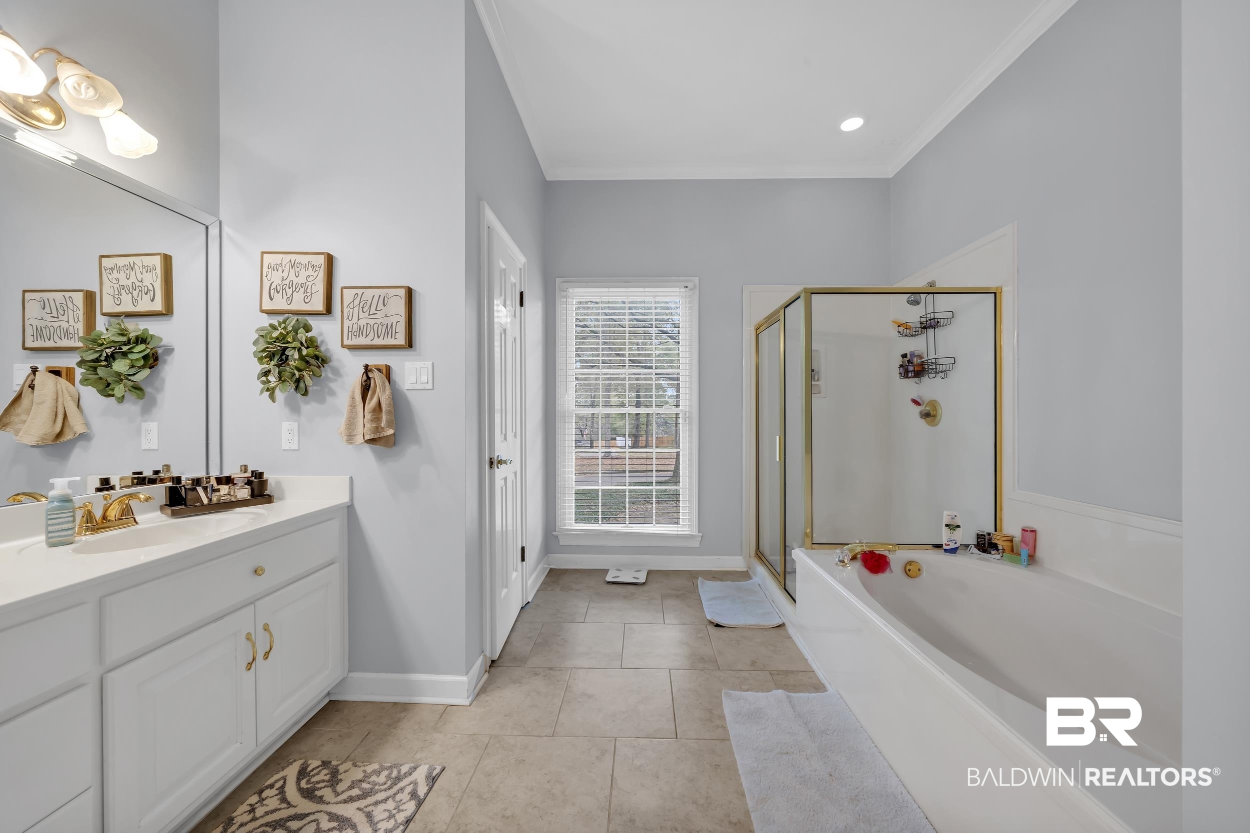 2858 Postoak Circle Mobile, AL 36693 - Photo 21 of 32 Bathroom featuring a bath, a shower stall, vanity, ornamental molding, and light tile patterned floors