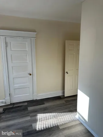 a view of door with wooden floor