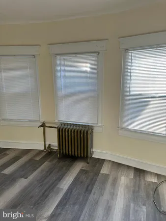 a view of livingroom with hardwood floor and hallway
