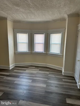 a view of space with wooden floor
