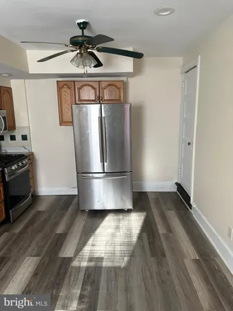 a white toilet sitting next to a bath tub