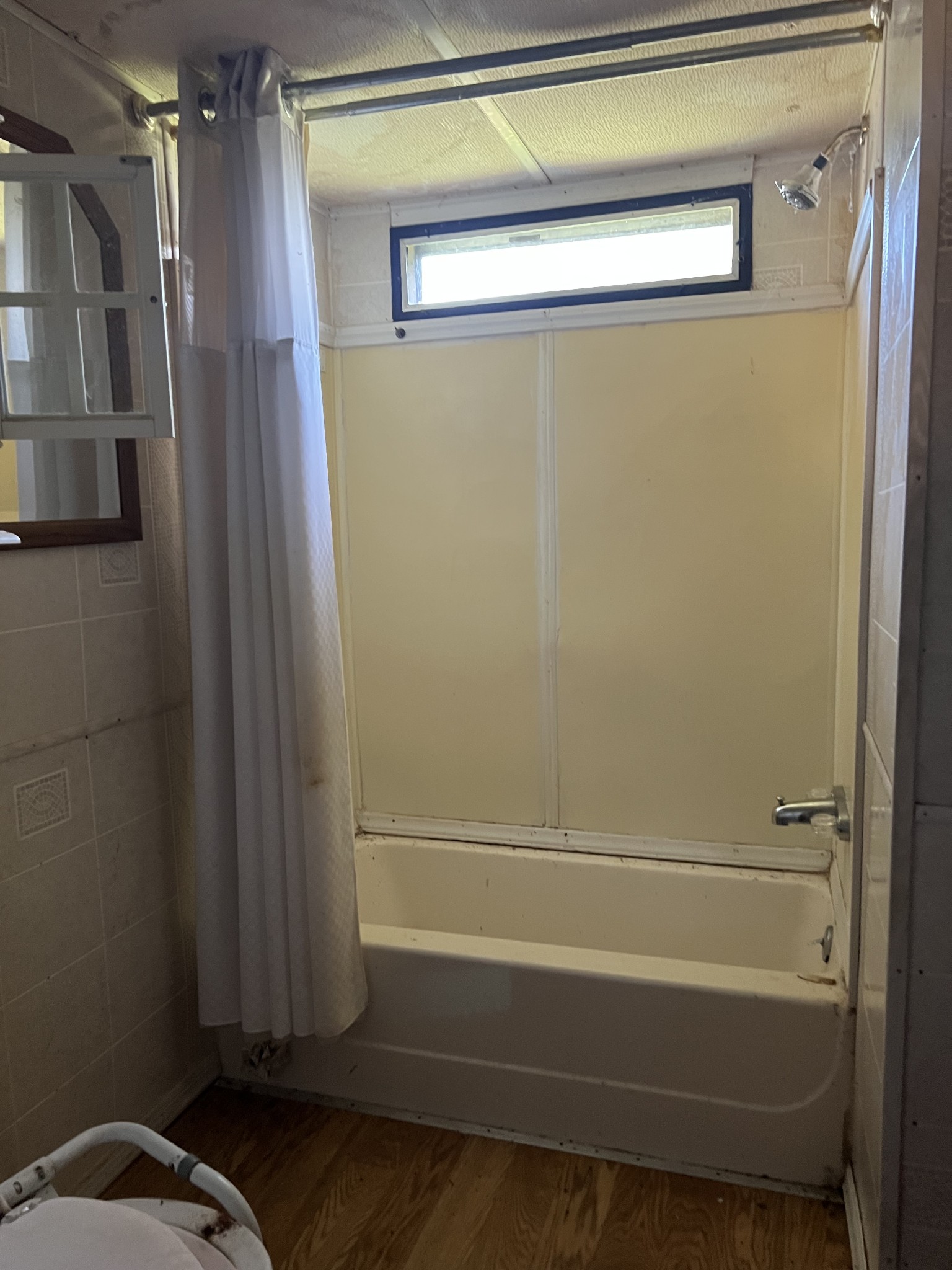 20 Providence Road Fayetteville, TN 37334 - Photo 16 of 19 a bathroom with a bathtub and a shower
