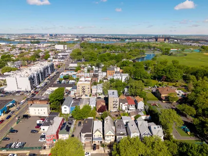 an aerial view of residential building with parking