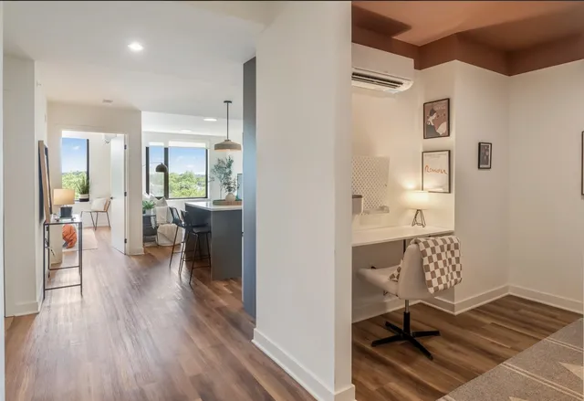 a living room with furniture and a table