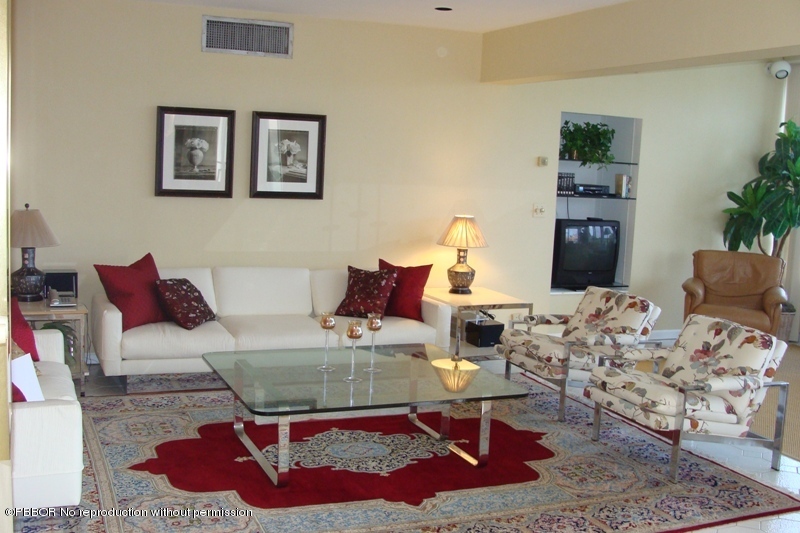 44 Cocoanut Row, Unit 322B Palm Beach, FL 33480 - Photo 2 of 10 a living room with furniture rug and wooden floor