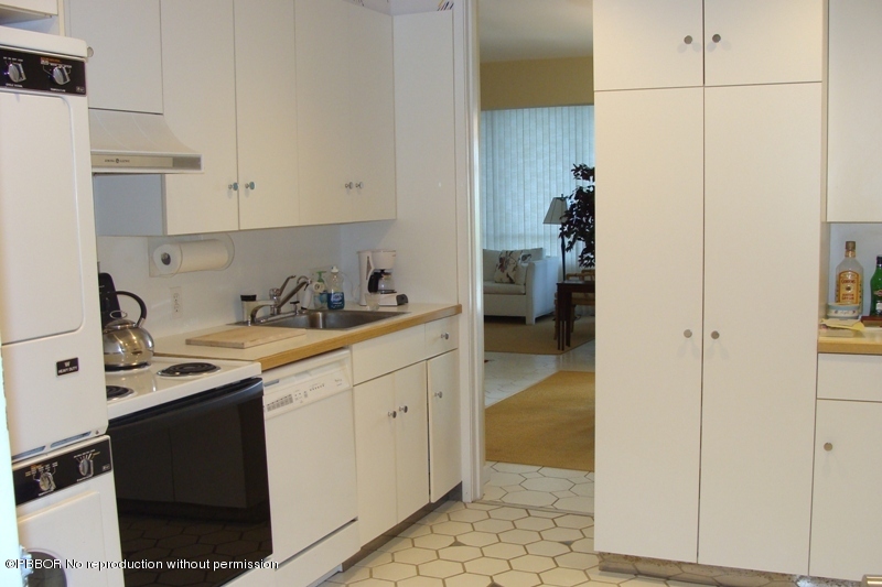 44 Cocoanut Row, Unit 322B Palm Beach, FL 33480 - Photo 5 of 10 a kitchen with a sink and cabinets
