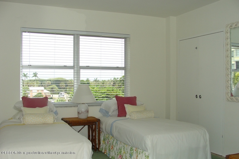 44 Cocoanut Row, Unit 322B Palm Beach, FL 33480 - Photo 8 of 10 a bedroom with a bed and large windows