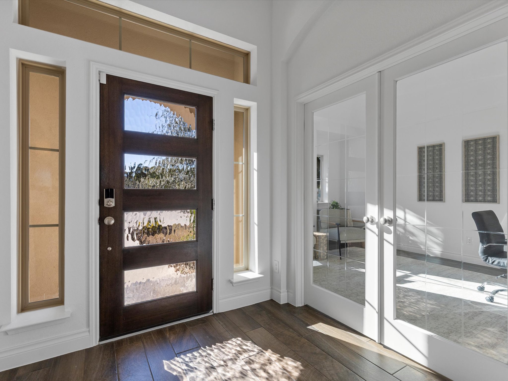 1009 Deer Rim Road Leander, TX 78641 - Photo 18 of 40 French doors to the left of the front entry open into a large home office.