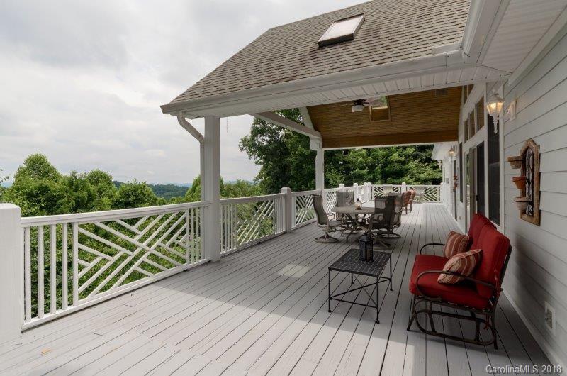 105 Spring Path, Unit 77 Hendersonville, NC 28739 - Photo 14 of 21 a view of two chairs in the balcony
