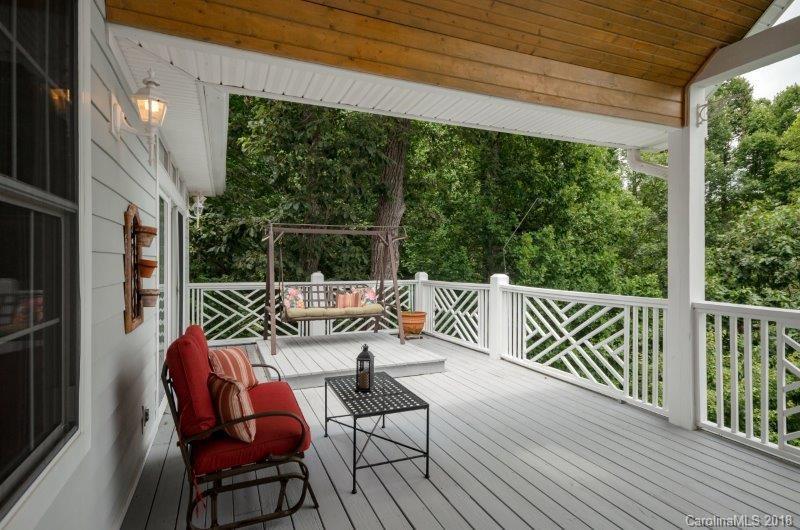 105 Spring Path, Unit 77 Hendersonville, NC 28739 - Photo 15 of 21 a view of balcony with wooden floor and outdoor seating