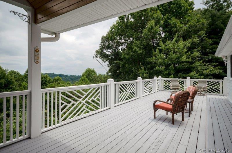 105 Spring Path, Unit 77 Hendersonville, NC 28739 - Photo 16 of 21 a balcony with wooden floor