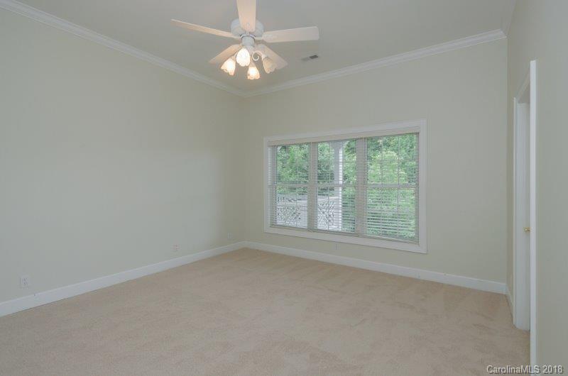105 Spring Path, Unit 77 Hendersonville, NC 28739 - Photo 20 of 21 an empty room with a window