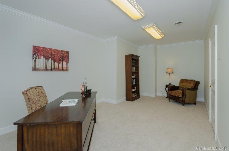 105 Spring Path, Unit 77 Hendersonville, NC 28739 - Photo 21 of 21 a living room with furniture and a piano